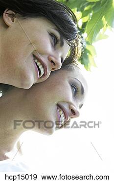 Stock Photograph - women smiling 
together. fotosearch 
- search stock 
photos, pictures, 
images, and photo 
clipart
