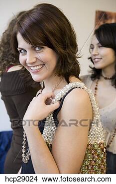 Stock Photo - young woman with 
beaded evening 
bag. fotosearch 
- search stock 
photos, pictures, 
images, and photo 
clipart