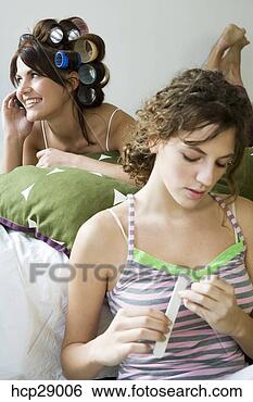 Stock Photo - young women pampering 
themselves. fotosearch 
- search stock 
photos, pictures, 
images, and photo 
clipart