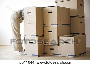 Stock Photo - woman rummaging 
through cardboard 
boxes. fotosearch 
- search stock 
photos, pictures, 
images, and photo 
clipart