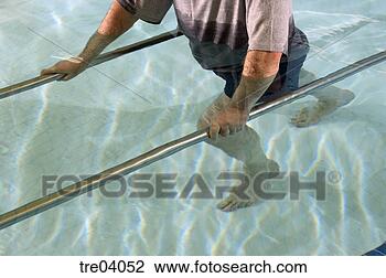Stock Photo - man having physical 
therapy in pool. 
fotosearch - search 
stock photos, 
pictures, images, 
and photo clipart