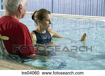 Stock Photography - man having physical 
therapy in pool. 
fotosearch - search 
stock photos, 
pictures, images, 
and photo clipart