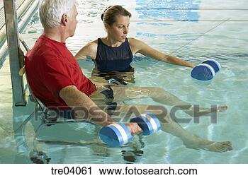 Stock Photography - man having physical 
therapy in pool. 
fotosearch - search 
stock photos, 
pictures, images, 
and photo clipart