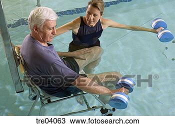 Stock Photo - man having physical 
therapy in pool. 
fotosearch - search 
stock photos, 
pictures, images, 
and photo clipart