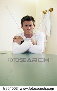 Stock Photo - man leaning on 
table. fotosearch 
- search stock 
photos, pictures, 
images, and photo 
clipart
