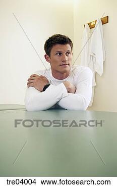 Stock Photo - man leaning on 
table. fotosearch 
- search stock 
photos, pictures, 
images, and photo 
clipart