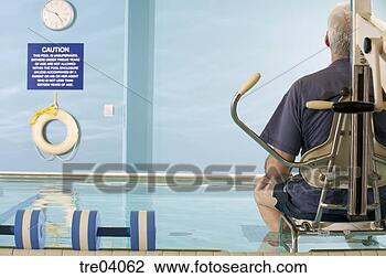 Stock Photo - man sitting in 
chair in pool. 
fotosearch - search 
stock photos, 
pictures, images, 
and photo clipart