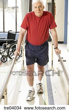 Stock Photo - man using bars 
to walk. fotosearch 
- search stock 
photos, pictures, 
images, and photo 
clipart