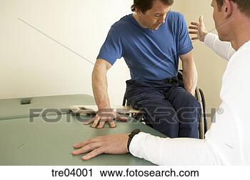 Stock Photography - man in wheelchair 
moving onto bench. 
fotosearch - search 
stock photos, 
pictures, images, 
and photo clipart