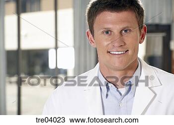Stock Photo - man in white coat 
smiling. fotosearch 
- search stock 
photos, pictures, 
images, and photo 
clipart