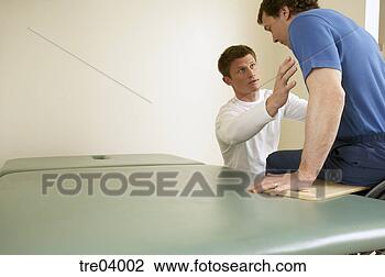 Stock Photo - physical therapist 
helping man in 
wheelchair move 
onto bench. fotosearch 
- search stock 
photos, pictures, 
images, and photo 
clipart