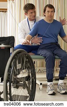 Stock Photo - physical therapist 
helping wheelchair-bound 
man. fotosearch 
- search stock 
photos, pictures, 
images, and photo 
clipart