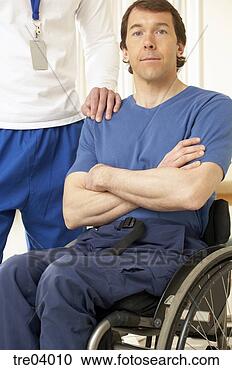 Stock Photography - physical therapist 
standing by wheelchair-bound 
man. fotosearch 
- search stock 
photos, pictures, 
images, and photo 
clipart