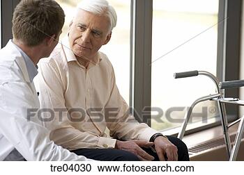 Stock Photography - senior man with 
walker talking 
to doctor. fotosearch 
- search stock 
photos, pictures, 
images, and photo 
clipart