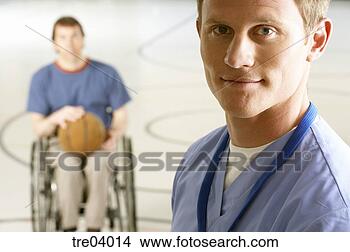 Stock Photo - wheelchair-bound 
man passing basketball 
to friend. fotosearch 
- search stock 
photos, pictures, 
images, and photo 
clipart