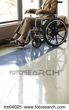 Stock Image - wheelchair-bound 
woman looking 
out window. fotosearch 
- search stock 
photos, pictures, 
images, and photo 
clipart