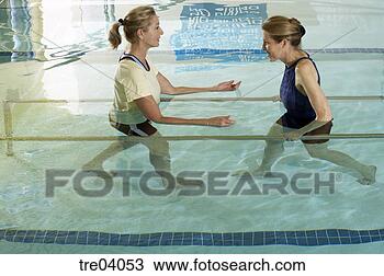 Stock Photo - woman having physical 
therapy in pool. 
fotosearch - search 
stock photos, 
pictures, images, 
and photo clipart