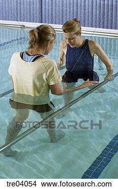 Stock Photo - woman having physical 
therapy in pool. 
fotosearch - search 
stock photos, 
pictures, images, 
and photo clipart