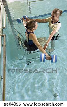 Stock Image - woman having physical 
therapy in pool. 
fotosearch - search 
stock photos, 
pictures, images, 
and photo clipart