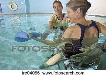 Stock Photo - woman having physical 
therapy in pool. 
fotosearch - search 
stock photos, 
pictures, images, 
and photo clipart