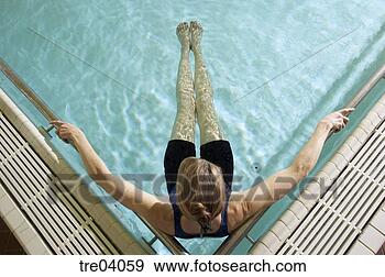 Stock Photograph - woman relaxing 
in pool. fotosearch 
- search stock 
photos, pictures, 
images, and photo 
clipart