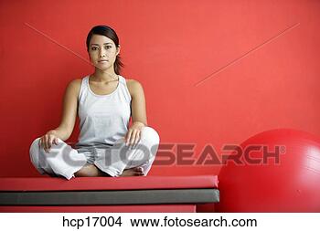 Stock Photo - asian woman sitting 
on mats. fotosearch 
- search stock 
photos, pictures, 
images, and photo 
clipart