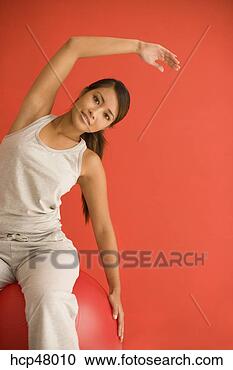 Stock Photography - asian woman stretching. 
fotosearch - search 
stock photos, 
pictures, images, 
and photo clipart
