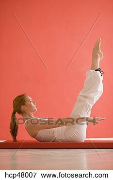 Picture - woman practicing 
yoga. fotosearch 
- search stock 
photos, pictures, 
images, and photo 
clipart
