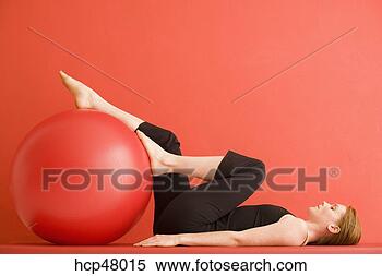 Stock Image - woman using exercise 
ball. fotosearch 
- search stock 
photos, pictures, 
images, and photo 
clipart