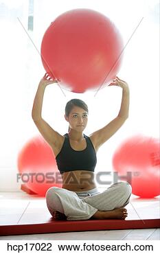 Stock Photo - young asian woman 
holding exercise 
ball. fotosearch 
- search stock 
photos, pictures, 
images, and photo 
clipart