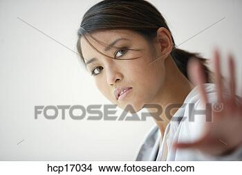 Stock Photo - young asian woman 
stretching. fotosearch 
- search stock 
photos, pictures, 
images, and photo 
clipart