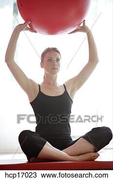Stock Photo - young woman holding 
exercise ball. 
fotosearch - search 
stock photos, 
pictures, images, 
and photo clipart