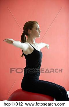 Stock Photo - young woman stretching. 
fotosearch - search 
stock photos, 
pictures, images, 
and photo clipart