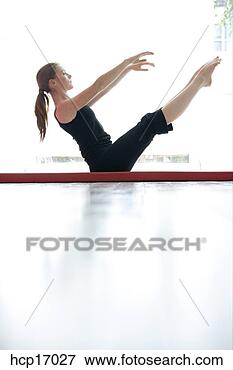Picture - young woman stretching. 
fotosearch - search 
stock photos, 
pictures, images, 
and photo clipart