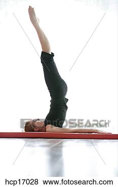 Stock Photo - young woman stretching. 
fotosearch - search 
stock photos, 
pictures, images, 
and photo clipart