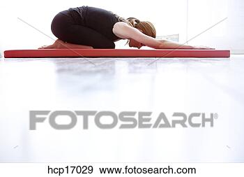 Stock Photograph - young woman stretching. 
fotosearch - search 
stock photos, 
pictures, images, 
and photo clipart