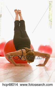 Stock Photo - young woman stretching 
on exercise ball. 
fotosearch - search 
stock photos, 
pictures, images, 
and photo clipart