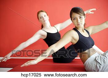 Stock Image - young women stretching. 
fotosearch - search 
stock photos, 
pictures, images, 
and photo clipart