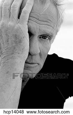 Stock Photo - senior man covering 
one eye. fotosearch 
- search stock 
photos, pictures, 
images, and photo 
clipart