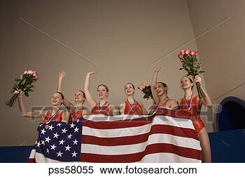 Stock Image - swim team holding 
american flag 
and waving in 
celebration. fotosearch 
- search stock 
photos, pictures, 
images, and photo 
clipart