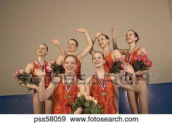 Stock Photograph - swim team waving 
in celebration. 
fotosearch - search 
stock photos, 
pictures, images, 
and photo clipart