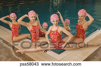 Stock Photo - synchronized swim 
team by swimming 
pool. fotosearch 
- search stock 
photos, pictures, 
images, and photo 
clipart