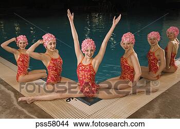 Stock Photo - synchronized swim 
team by swimming 
pool. fotosearch 
- search stock 
photos, pictures, 
images, and photo 
clipart