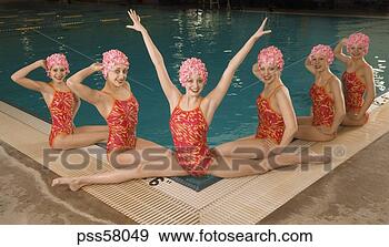 Stock Photograph - synchronized swim 
team by swimming 
pool. fotosearch 
- search stock 
photos, pictures, 
images, and photo 
clipart
