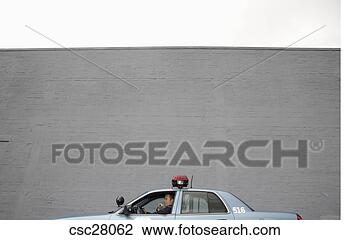 Stock Photo - male police officer 
driving patrol 
car. fotosearch 
- search stock 
photos, pictures, 
images, and photo 
clipart