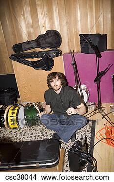 Stock Photo - drummer surrounded 
by instruments. 
fotosearch - search 
stock photos, 
pictures, images, 
and photo clipart