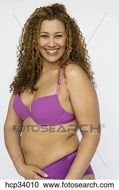 Stock Photography - woman smiling 
wearing bra and 
panties. fotosearch 
- search stock 
photos, pictures, 
images, and photo 
clipart