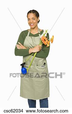 Stock Photo - african woman 
holding cut flowers. 
fotosearch - search 
stock photos, 
pictures, images, 
and photo clipart