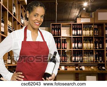Stock Photo - saleswoman in 
wine store. fotosearch 
- search stock 
photos, pictures, 
images, and photo 
clipart