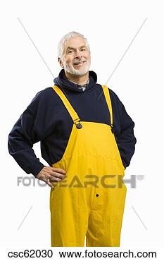 Stock Photography - senior male fisherman 
with hands on 
hips. fotosearch 
- search stock 
photos, pictures, 
images, and photo 
clipart